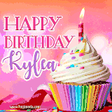 A vibrant birthday GIF featuring a rainbow-colored cupcake topped with white frosting, sprinkles, and a lit candle. The text reads 'Happy Birthday Kylea' in bold pink and violet letters with white outline.
