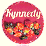 Beautifully decorated red velvet berry birthday cake with vibrant fruits and a glowing 'Kynnedy' name, adding a touch of sweetness and sparkle.