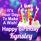 A colorful birthday GIF for Kynsley featuring a cupcake with vibrant lit candles and the text 'It's Your Day to Make a Wish! Happy Birthday Kynsley' in bold letters on a festive purple background.