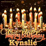 A glowing personalized birthday GIF with name Kynslie featuring lit candles with intricate designs, warm lighting, and the text 'Happy Birthday' in an elegant font.