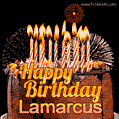 A rich chocolate cake topped with glowing birthday candles and surrounded by bright fireworks. The animated GIF displays the message 'Happy Birthday Lamarcus' in golden text.