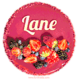 Beautifully decorated red velvet berry birthday cake with vibrant fruits and a glowing 'Lane' name, adding a touch of sweetness and sparkle.