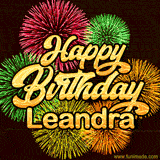 Golden text reading 'Happy Birthday Leandra' surrounded by vibrant fireworks in red, green, and yellow, set against a dark background in this celebratory birthday GIF.
