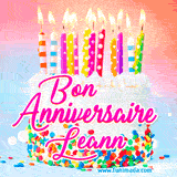 A white birthday cake covered in colorful sprinkles, topped with bright candles, and French text 'Bon Anniversaire Leann' on a pastel gradient background in an animated GIF.