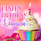 A vibrant birthday GIF featuring a rainbow-colored cupcake topped with white frosting, sprinkles, and a lit candle. The text reads 'Happy Birthday Leanna' in bold pink and violet letters with white outline.
