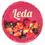 Beautifully decorated red velvet berry birthday cake with vibrant fruits and a glowing 'Leda' name, adding a touch of sweetness and sparkle.