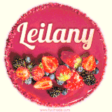 Beautifully decorated red velvet berry birthday cake with vibrant fruits and a glowing 'Leilany' name, adding a touch of sweetness and sparkle.