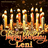 A glowing personalized birthday GIF with name Leni featuring lit candles with intricate designs, warm lighting, and the text 'Happy Birthday' in an elegant font.