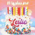 Personalized for Leslie elegant birthday cake adorned with rainbow sprinkles, colorful candles and glitter
