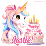 An adorable animated unicorn with soft pastel colors sits beside a birthday cake with glowing candles, and a pink 'Happy Birthday Leslie!' words.