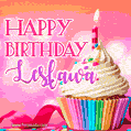 A vibrant birthday GIF featuring a rainbow-colored cupcake topped with white frosting, sprinkles, and a lit candle. The text reads 'Happy Birthday Lesława' in bold pink and violet letters with white outline.