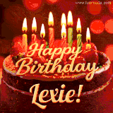 Beautifully decorated red velvet berry birthday cake with vibrant fruits and a glowing 'Lexie' name, adding a touch of sweetness and sparkle.