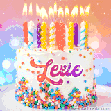 A cheerful white birthday cake with multicolor sprinkles, lit candles, and 'Lexie' written in vibrant letters, in an animated GIF.