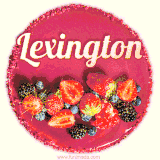 Beautifully decorated red velvet berry birthday cake with vibrant fruits and a glowing 'Lexington' name, adding a touch of sweetness and sparkle.