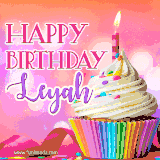A vibrant birthday GIF featuring a rainbow-colored cupcake topped with white frosting, sprinkles, and a lit candle. The text reads 'Happy Birthday Leyah' in bold pink and violet letters with white outline.