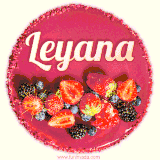 Beautifully decorated red velvet berry birthday cake with vibrant fruits and a glowing 'Leyana' name, adding a touch of sweetness and sparkle.