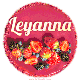 Beautifully decorated red velvet berry birthday cake with vibrant fruits and a glowing 'Leyanna' name, adding a touch of sweetness and sparkle.