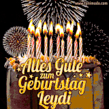 A chocolate birthday cake with glowing candles, the German text 'Alles Gute zum Geburtstag Leydi,' and vibrant fireworks lighting up the background in an animated GIF.