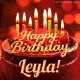 Beautifully decorated red velvet berry birthday cake with vibrant fruits and a glowing 'Leyla' name, adding a touch of sweetness and sparkle.