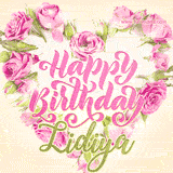 A stunning heart made of pink roses surrounds the elegant script text 'Happy Birthday Lidiya' on a soft beige background. Animated sparkles add a magical and festive feel.