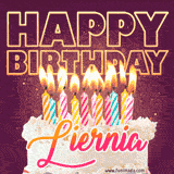 A colorful birthday cake topped with lit candles, with the words 'Happy Birthday Liernia' in bold glowing letters on a burgundy background. Animated flames add a festive touch.