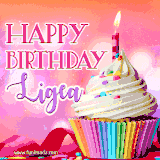A vibrant birthday GIF featuring a rainbow-colored cupcake topped with white frosting, sprinkles, and a lit candle. The text reads 'Happy Birthday Ligea' in bold pink and violet letters with white outline.