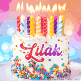 A cheerful white birthday cake with multicolor sprinkles, lit candles, and 'Lilah' written in vibrant letters, in an animated GIF.