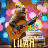 Animated birthday GIF showing a capybara playing guitar and singing beside a birthday cake with the name Lilah in large letters and colorful bokeh lights in the background.