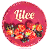 Beautifully decorated red velvet berry birthday cake with vibrant fruits and a glowing 'Lilee' name, adding a touch of sweetness and sparkle.