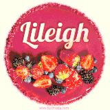 Beautifully decorated red velvet berry birthday cake with vibrant fruits and a glowing 'Lileigh' name, adding a touch of sweetness and sparkle.