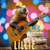 Animated birthday GIF showing a capybara playing guitar and singing beside a birthday cake with the name Lillie in large letters and colorful bokeh lights in the background.