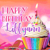 A vibrant birthday GIF featuring a rainbow-colored cupcake topped with white frosting, sprinkles, and a lit candle. The text reads 'Happy Birthday Lillyann' in bold pink and violet letters with white outline.