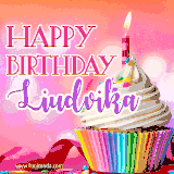A vibrant birthday GIF featuring a rainbow-colored cupcake topped with white frosting, sprinkles, and a lit candle. The text reads 'Happy Birthday Liudvika' in bold pink and violet letters with white outline.