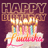 A colorful birthday cake topped with lit candles, with the words 'Happy Birthday Liudvika' in bold glowing letters on a burgundy background. Animated flames add a festive touch.
