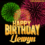 A captivating GIF with bursts of green, pink, and orange fireworks lighting up the night sky, accompanied by 'Happy Birthday Llewyn' in glowing golden text.
