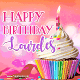 A vibrant birthday GIF featuring a rainbow-colored cupcake topped with white frosting, sprinkles, and a lit candle. The text reads 'Happy Birthday Lourdes' in bold pink and violet letters with white outline.