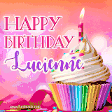 A vibrant birthday GIF featuring a rainbow-colored cupcake topped with white frosting, sprinkles, and a lit candle. The text reads 'Happy Birthday Lucienne' in bold pink and violet letters with white outline.