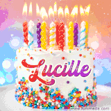 A cheerful white birthday cake with multicolor sprinkles, lit candles, and 'Lucille' written in vibrant letters, in an animated GIF.