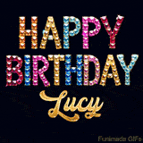 Vibrant luxury birthday greeting card for Lucy, showing glittering gemstone letters and golden calligraphy on a dark background with twinkling shine effects.