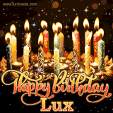 A glowing personalized birthday GIF with name Lux featuring lit candles with intricate designs, warm lighting, and the text 'Happy Birthday' in an elegant font.