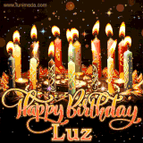 A glowing personalized birthday GIF with name Luz featuring lit candles with intricate designs, warm lighting, and the text 'Happy Birthday' in an elegant font.