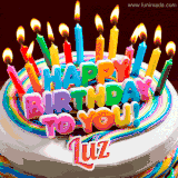 A colorful birthday cake topped with lit candles, with the words 'Happy Birthday Luz' in bold glowing letters on a burgundy background. Animated flames add a festive touch.