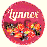 Beautifully decorated red velvet berry birthday cake with vibrant fruits and a glowing 'Lynnex' name, adding a touch of sweetness and sparkle.