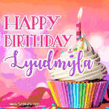 A vibrant birthday GIF featuring a rainbow-colored cupcake topped with white frosting, sprinkles, and a lit candle. The text reads 'Happy Birthday Lyudmyla' in bold pink and violet letters with white outline.