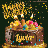 A delightful chocolate birthday cake with bright candles and 'Happy Birthday Lyvia' written in gold amidst a shower of animated stars.
