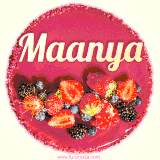 Beautifully decorated red velvet berry birthday cake with vibrant fruits and a glowing 'Maanya' name, adding a touch of sweetness and sparkle.