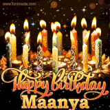 A glowing personalized birthday GIF with name Maanya featuring lit candles with intricate designs, warm lighting, and the text 'Happy Birthday' in an elegant font.