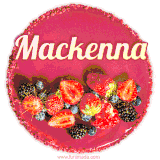 Beautifully decorated red velvet berry birthday cake with vibrant fruits and a glowing 'Mackenna' name, adding a touch of sweetness and sparkle.