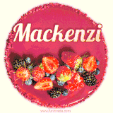 Beautifully decorated red velvet berry birthday cake with vibrant fruits and a glowing 'Mackenzi' name, adding a touch of sweetness and sparkle.