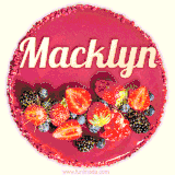 Beautifully decorated red velvet berry birthday cake with vibrant fruits and a glowing 'Macklyn' name, adding a touch of sweetness and sparkle.